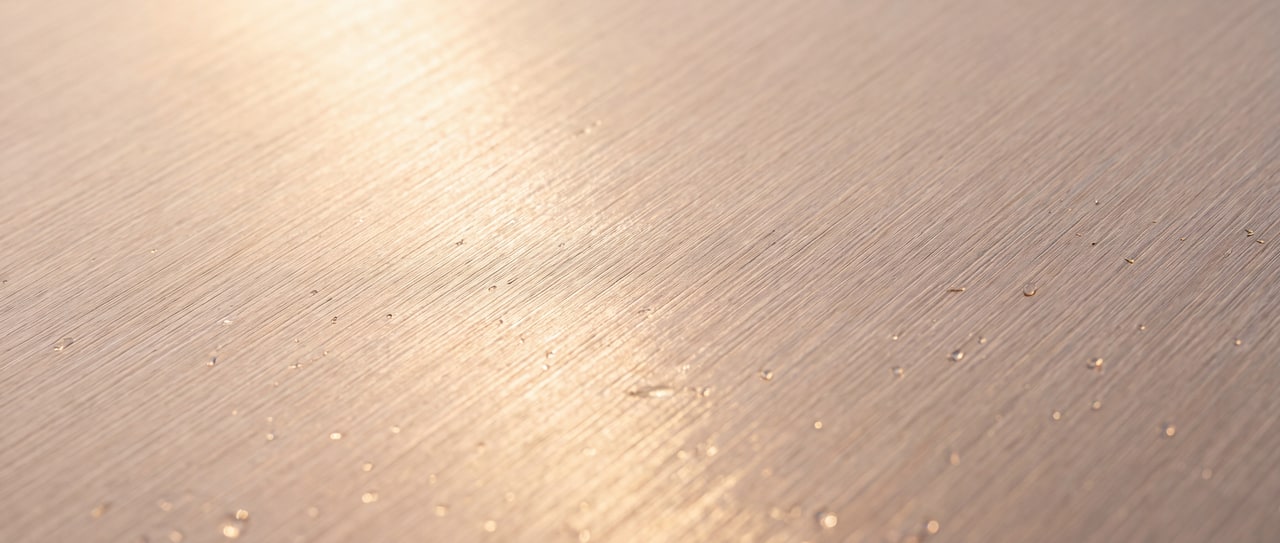 Milled metal and paper — the material a card is made from.